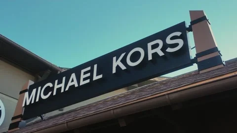 Michael Kors Storefront Pan to Logo Stock Footage 299624502