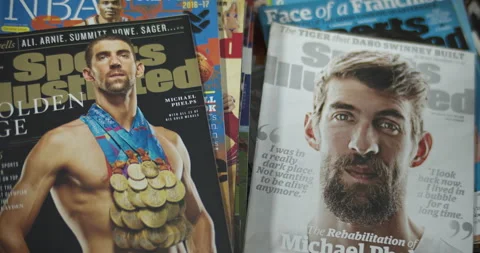 Michael Phelps with all 23 Gold Medals, cover of Sports Illustrated Magazine Stock Footage 146351576