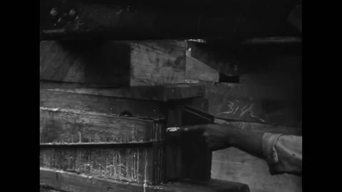 MICHIGAN - 1924 - Workers walking under a freighter on construction dock before Stock Footage 312792567