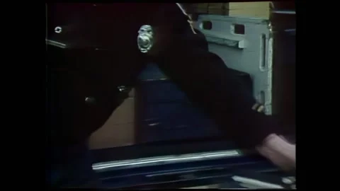 MICHIGAN - 1977 - Cops load life support equipment into special emergency Stock Footage 296407082