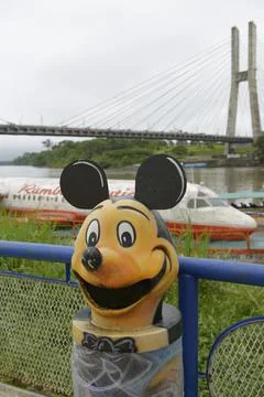 Mickey Mouse garbage can lid at the wharf, Coca, Orellana, Ecuador Stock Photos