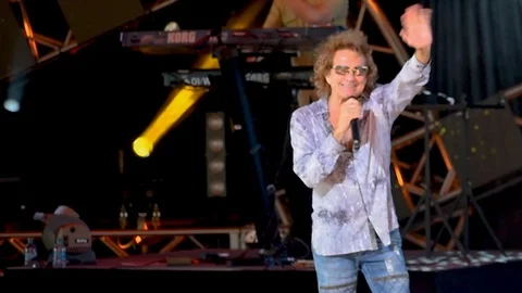 Mickey Thomas by Starship singing We Built This City in Epcot Stock Footage 109170301