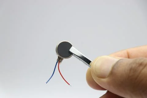 Micro coin vibration motor for haptic feedback used in electronics Stock Photos