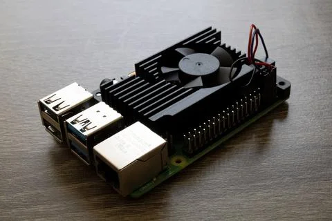 Micro-computer set with black heatsink for electrical engineering on table Stock Photos