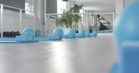 Micro dolly moving is revealing row of blue balls on foam blocks and mats, Stock Footage 338338392