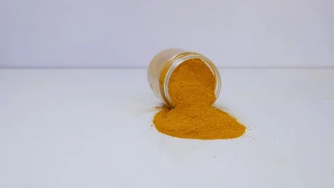 Micro  dropping glass bottle filled with turmeric powder Stock Footage 147696414