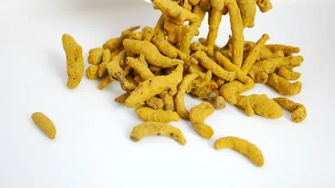 Micro  dropping turmeric over a white table Stock Footage 147695447