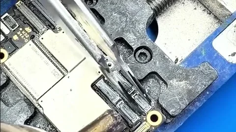 Micro Electronics Repair - Removing Components from Mobile Phone PCB Stock Footage 333503812
