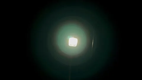 Micro focus of a glowing light on the lens from the glass object Stock Footage 275244475