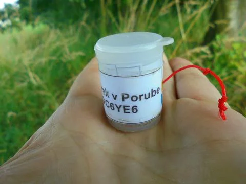 Micro geocache container on open palm, Ostrava outdoor close-up Stock Photos