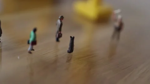 Micro people on the desk in a street like environment Stock Footage 270459712