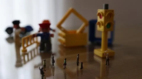 Micro people on the desk in a street like environment Stock Footage 270459792