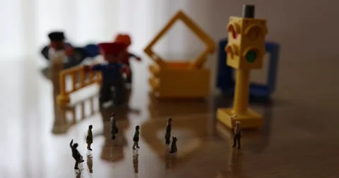 Micro people on the desk in a street like environment Stock Footage 270460605