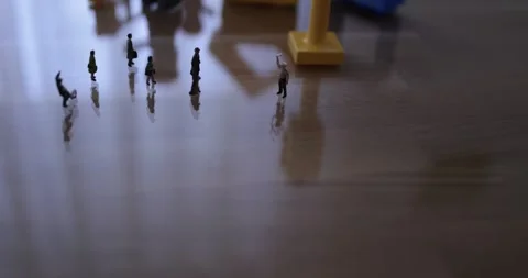Micro people on the desk in a street like environment Stock Footage 270460689