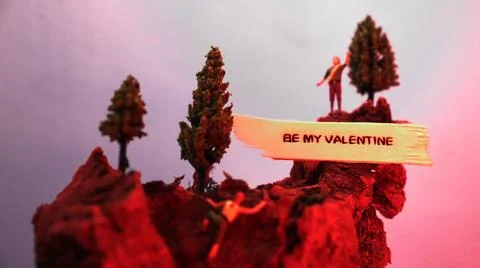 Micro people love declaration on a mountain Stock Photos
