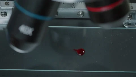 Micro pipette putting blood sample on microscope to test dna 스톡 동영상 167220047