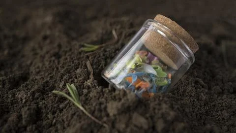 Micro plastic fragments found in the soil. Stock Photos