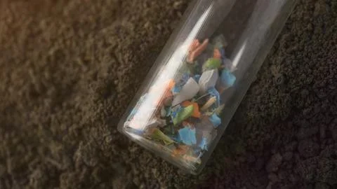 Micro plastic fragments found in the soil. Stock Photos