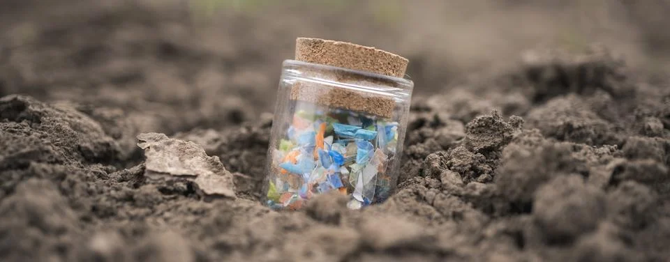 Micro plastic fragments found in the soil. Stock Photos