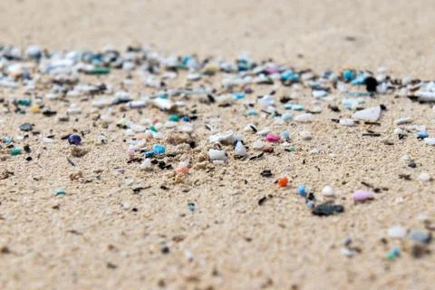 Micro Plastics Washing Ashore On The Beach In Hawaii, USA Stock Photos