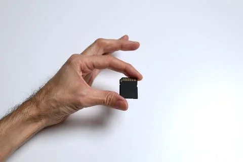 Micro SD Card On Open Palm Digital Storage Memory Technology Concept Stock Photos