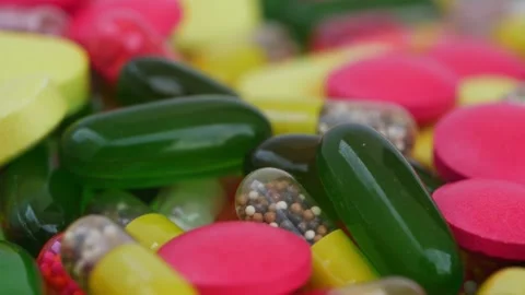 Micro shot of bunch of tablets, Rotating view of colorful tablets Video stock 147700558