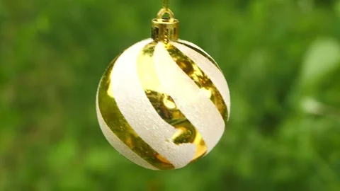 Micro shot of Christmas gift ball with golden strips Stockbeeldmateriaal 167069809
