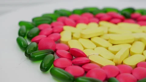 Micro shot colorful tablets, Rotating shot of different color tablets Video stock 147700405