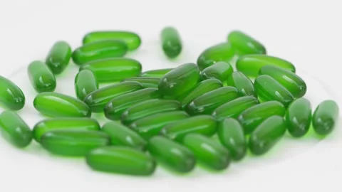 Micro shot of green tablets, Rotating shot of tablets Vídeo Stock 147700308