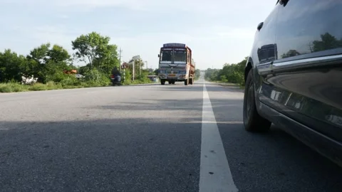 Micro shot of truck passing through road, View of truck on Indian road Stock-Footage 156973399