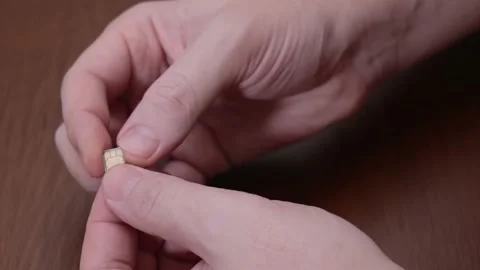 Micro SIM close-up. SIM for phone in hand Stock Footage 145367371