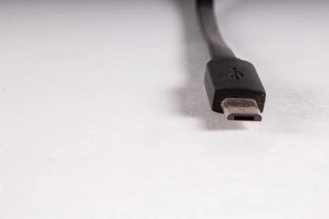 Micro usb black wire on white background Stock Photos