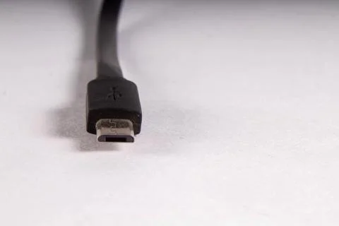 Micro usb black wire on white background Stock Photos