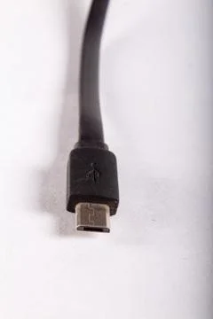 Micro usb black wire on white background Stock Photos