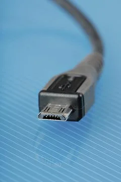 Micro USB cable connector used in cell phones for power and data Stock Photos