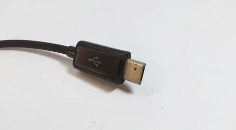 Micro USB OTG cable, black, close up, white background Foto stock