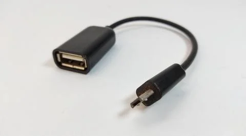 Micro USB OTG cable, black, close up, white background Stock Photos