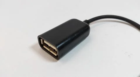 Micro USB OTG cable, black, close up, white background Stock Photos