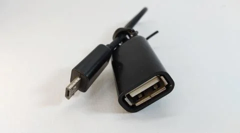 Micro USB OTG cable, black, close up, white background Foto stock