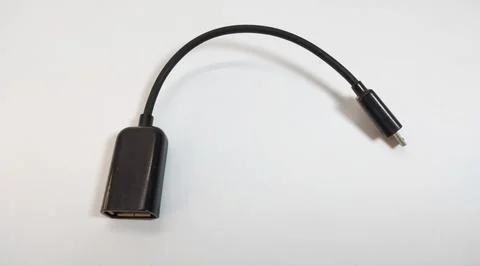 Micro USB OTG cable, black, close up, white background Stock Photos
