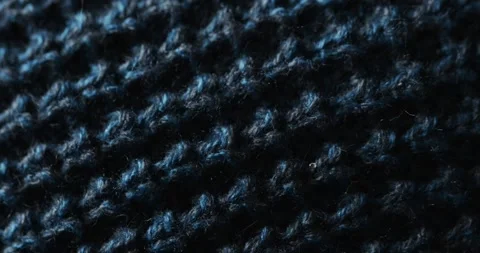Micro video of close up of blue wooly crochet fabric with copy space Stock Footage 331358792
