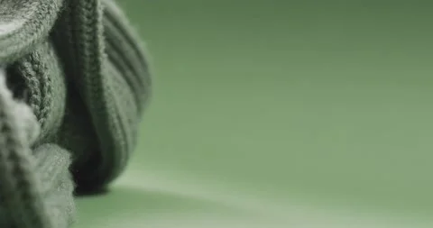 Micro video of close up of green wooly crochet fabric with copy space on green Stock Footage 331295272