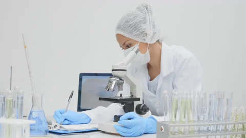 Microbiologist looking at test results. Stock Footage 147051967