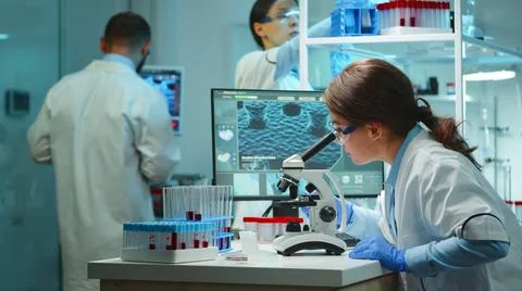 Microbiologist working late at night for new vaccine 스톡 사진