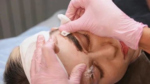 Microblading eyebrows work flow in a beauty salon. Woman Stockbeeldmateriaal 149008361