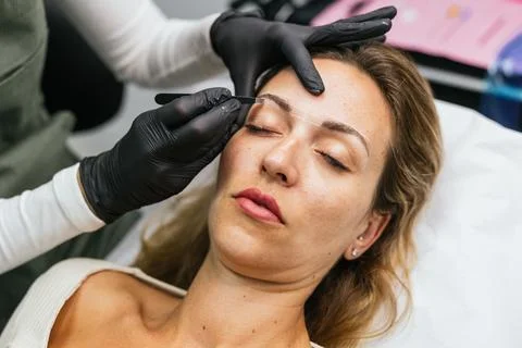 Microblading preparation, eyebrow measuring with thread technique Stock Photos