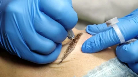 Microblading procedure. Master works with the eyebrows. Stock Footage 60124941