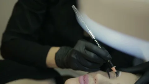 Microblading procedure. Master works with the eyebrows. Stock Footage 87405666
