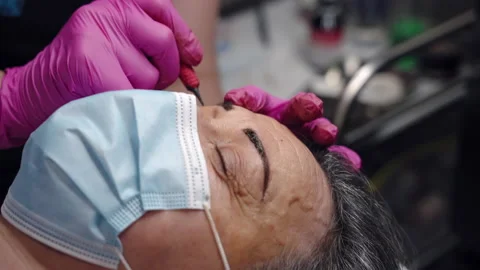 Microblading procedures in spa beauty salon, permanent eyebrows tattoo Stock Footage 164051373