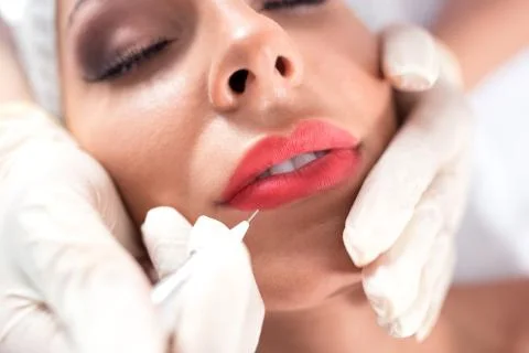 Microblading technique applied on kissable lips Stock Photos
